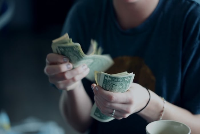 girl counting a lot of money